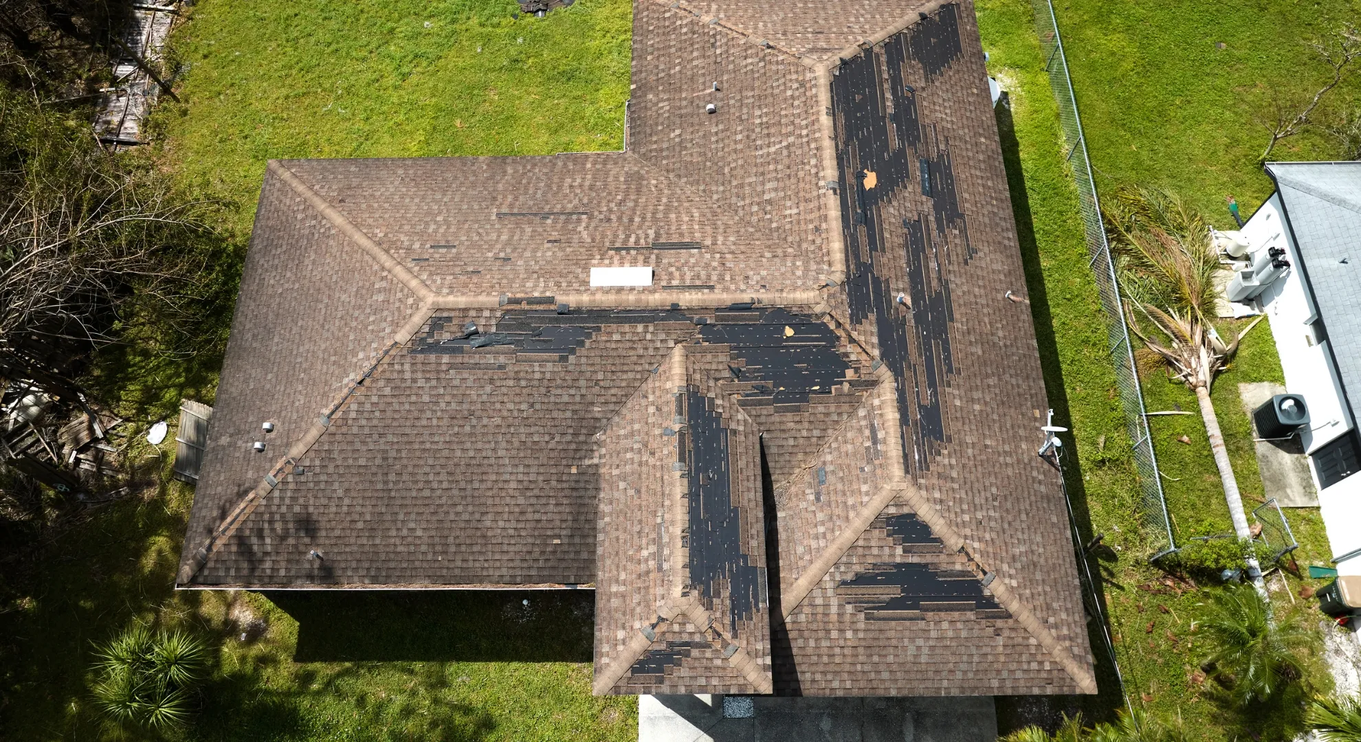 Construction worker measuring roofing materials for accurate installation